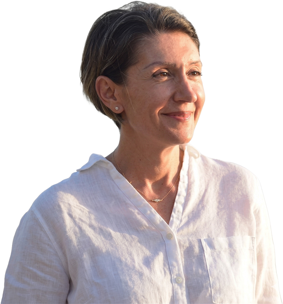 Evdoxia founder Inner Safety Healing looking peacefully into the distance soft natural light